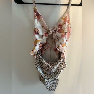 Adorable one piece with cut outs